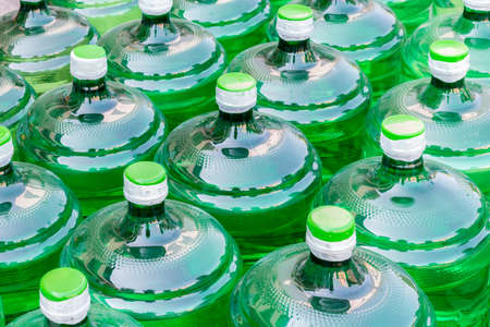 green bottles of water, abstract background