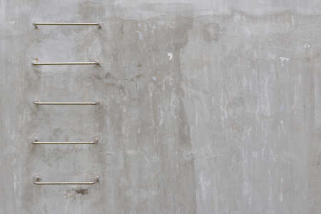 fixed ladder on concrete wall, abstract backgroundの写真素材