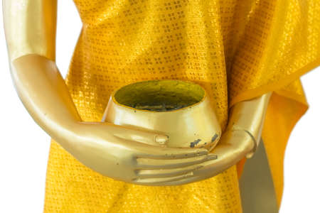 gold monk statue holding alms bowl