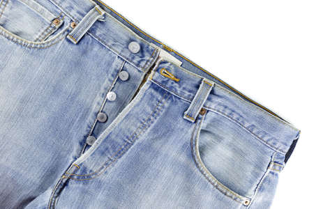 old blue jeans with button on white background