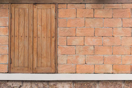 old wood window on clay brick wallの写真素材