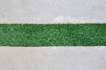 artificial grass and concrete floor, abstract backgroundの写真素材