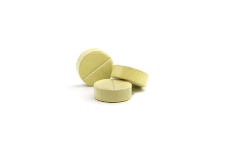 green pills on white background, selective focusの写真素材