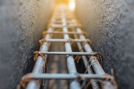 reinforcement steel rod and deformed bar in plastic formwork selective focusの写真素材