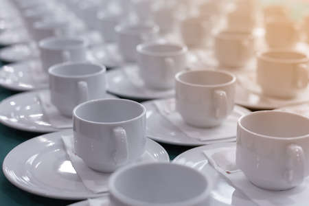 blank cups of coffee line up on the table, selective focus