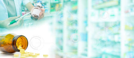 Drugstore with a bottle of pills and syrup with graphic decorationの写真素材