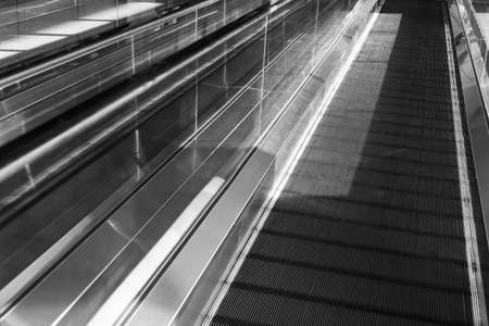 moving walkway, travelater, with black and white tone, travel conceptの写真素材