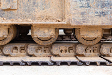 dirty dozer shovel wheel, Crawler belt, construction industry concept backgroundの写真素材