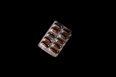 expaired pills of capsule in tablet ioslated on black background with clipping path, medical and health care conceptの写真素材