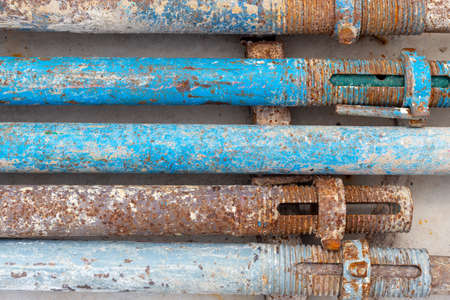 old steel tube scaffolding, rusty industry construction concept backgroundの写真素材