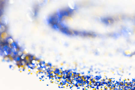 abstract glitter bokeh background, colorful, blue gold an dsilver, selective focusの写真素材