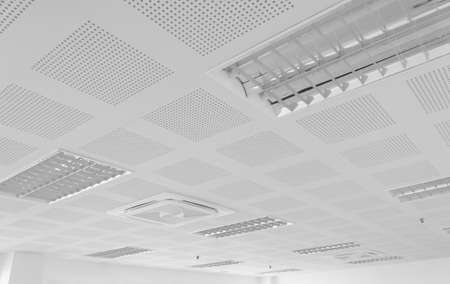 acoustic ceiling with lighting and air condition, black and white tone, industry construction concept backgroundの写真素材