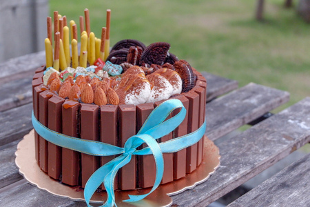 Delicious dark chocolate cake on wood table background