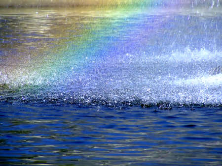 Rainbow in a splash water dropsの写真素材