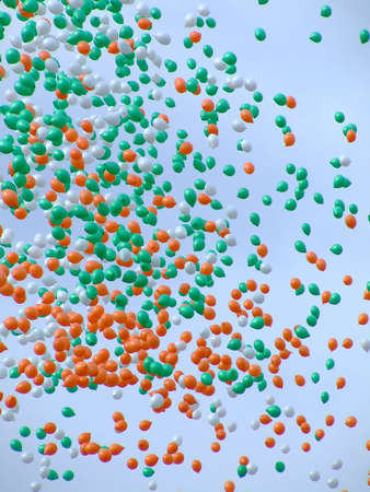 Bunch of helium balloons in the skyの写真素材