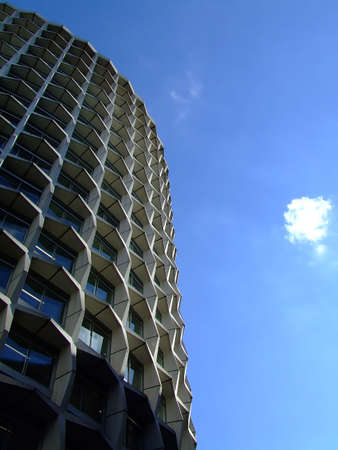 Skyscraper from interesting angle and sky in background
