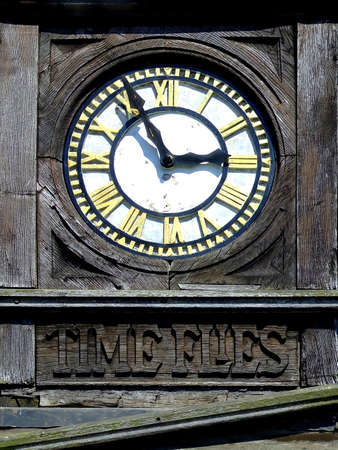 Old wooden clock time fliesの写真素材