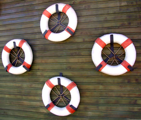 Four life vests on the ship hullの写真素材