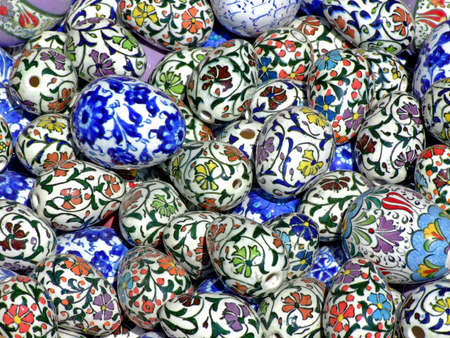 Bunch of Easter eggs in a basket with Islamic pattern