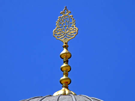 Golden ornament on a top of mosque domeの写真素材