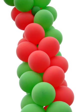 Red and green balloons in screw formation isolatedの写真素材