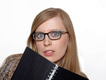 Blonde business woman with agenda and glasses isolated on white