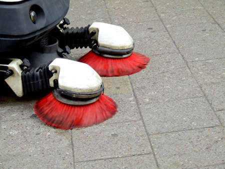 Street cleaning machine with red brushesの写真素材