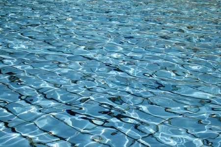 Light blue swimming pool ripple water surface