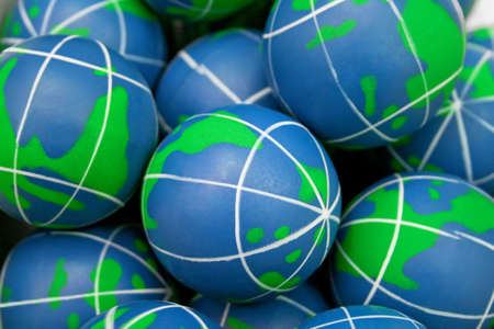 A bunch of blue and green rubber globes