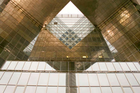 Triangular building structure with front glass facade