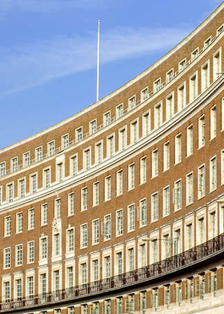 Oval sunny building with lot of windows の写真素材