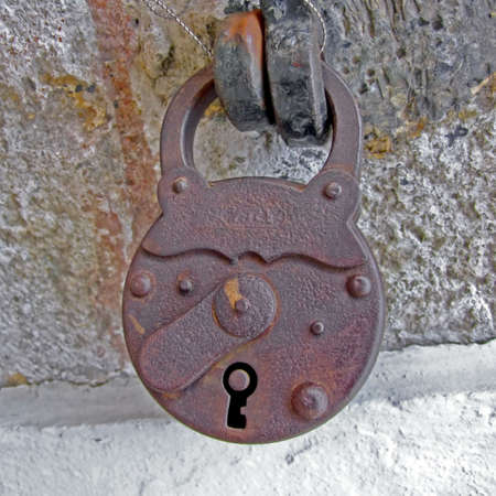 Old and rusty padlock locked safe security