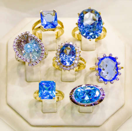 Beautiful collection of gold rings with blue diamondsの写真素材