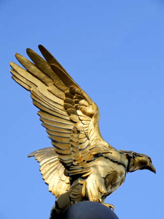 Golden eagle statue with big expanded wingsの写真素材