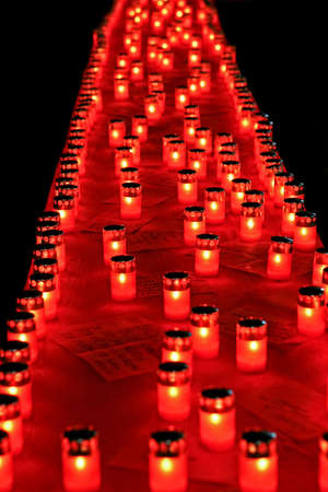 A lot of red candles in line