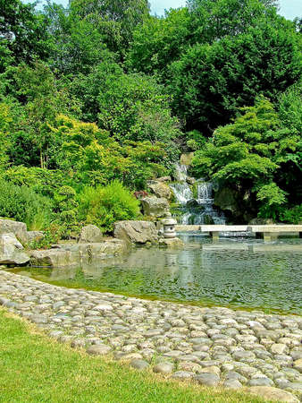 Traditional Japanese garden with waterfalls and pondの写真素材