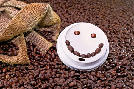 Smiley face on the top of take away coffee cupの写真素材