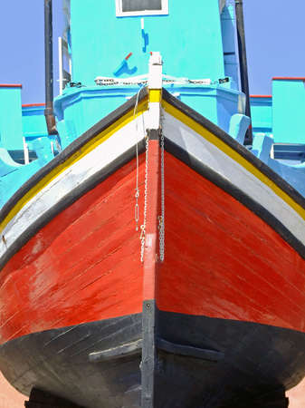 Medieval fisherman wooden boat painted in redの写真素材