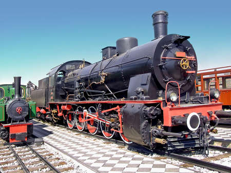 Small and big locomotive train on the tracks 