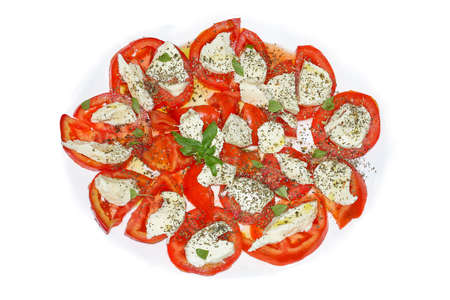 Fresh salad made from mozzarella tomatoes and basil