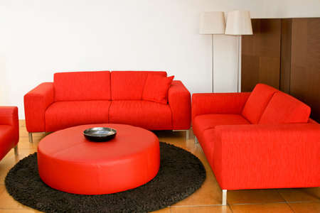 Red sofas in the living room with lampの写真素材