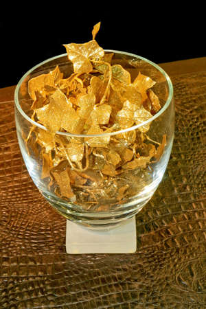 Big decorative bowl with golden leafs decorationの写真素材