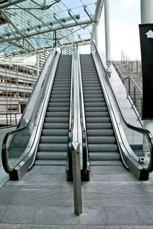 Two parallel automatic escalators in business building