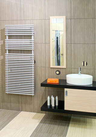 Bathroom with round basin and towels heaterの写真素材
