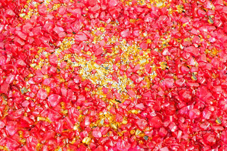Background of red stones in vivid red colorの写真素材