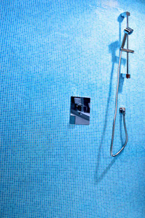 Detail of modern shower with blue tilesの写真素材