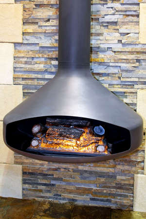 Hanging open fireplace in iron with chimneyの写真素材