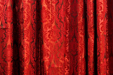 Wavy drapery material textile with red patternの写真素材