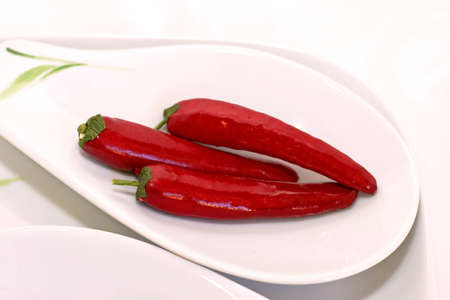 Red hot spice chilly peppers on plate