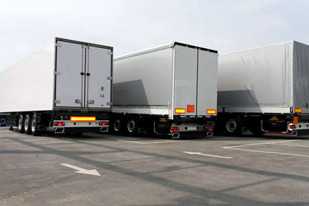 Three big lorry trailers in grey color の写真素材